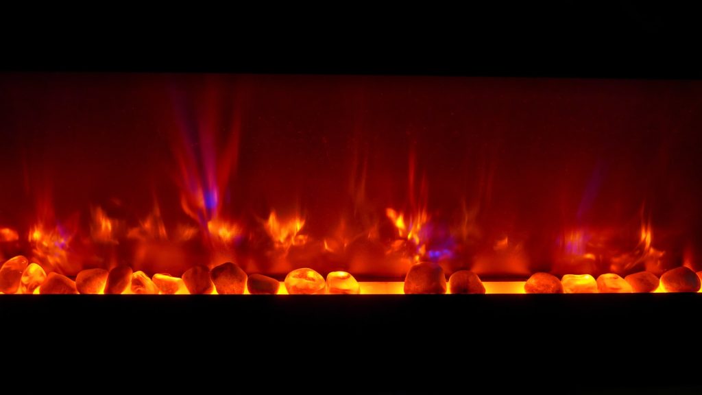 lighted candles on brown wooden table