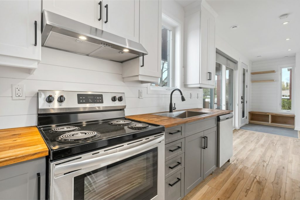 a kitchen with white cabinets